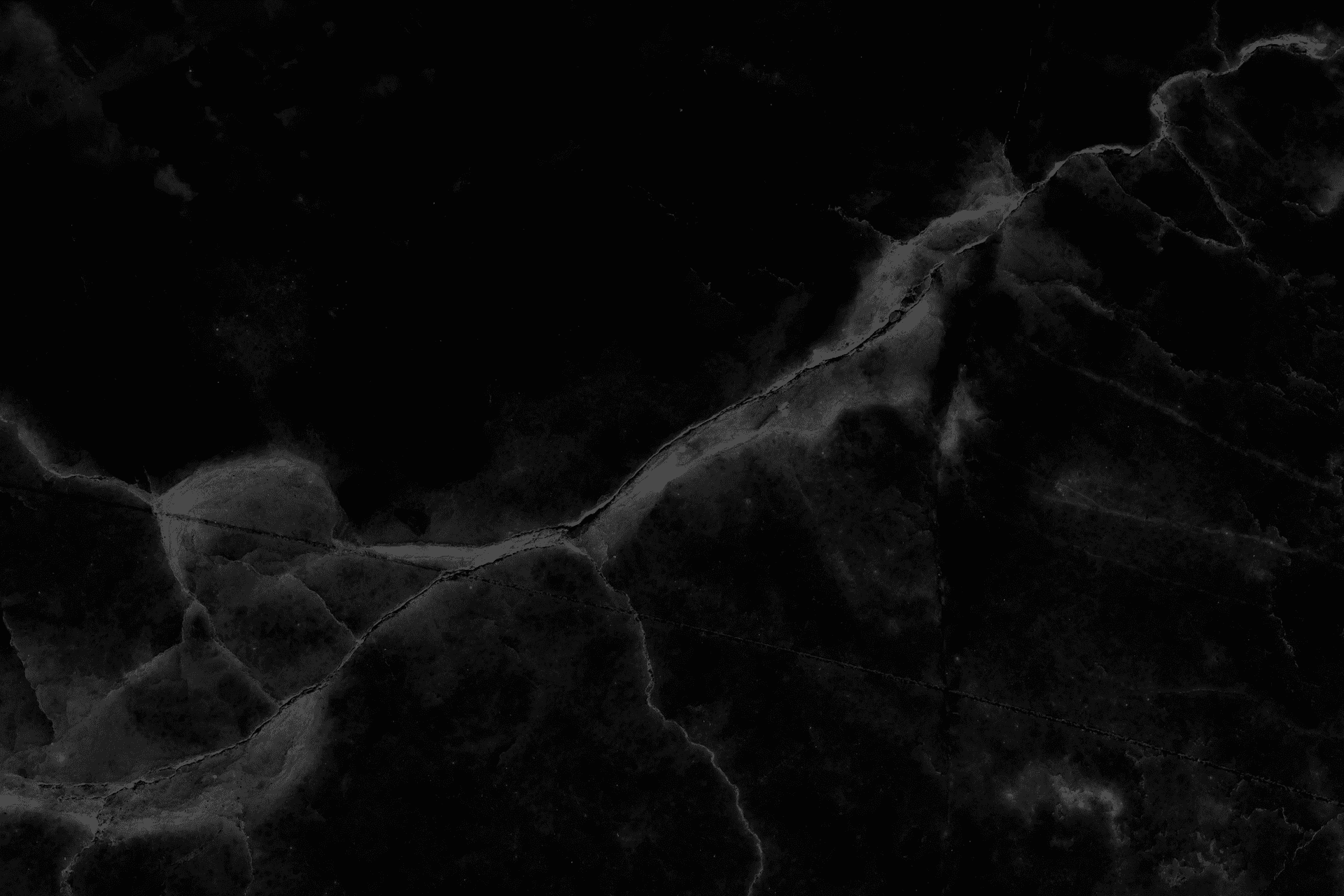 Abstract black marble texture with natural patterns.