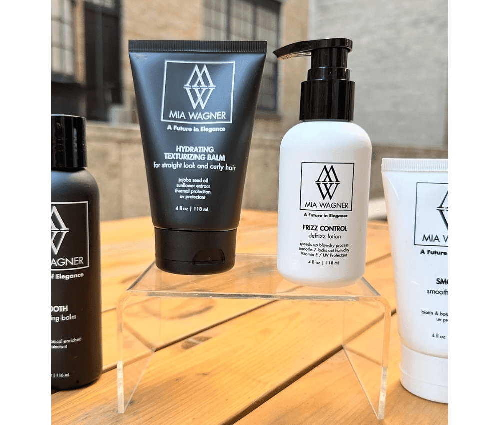 Assortment of Mia Wagner hair care products displayed on shelf.