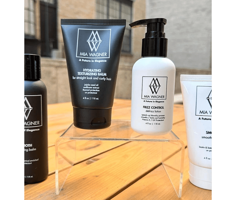 Assortment of Mia Wagner hair care products displayed on shelf.