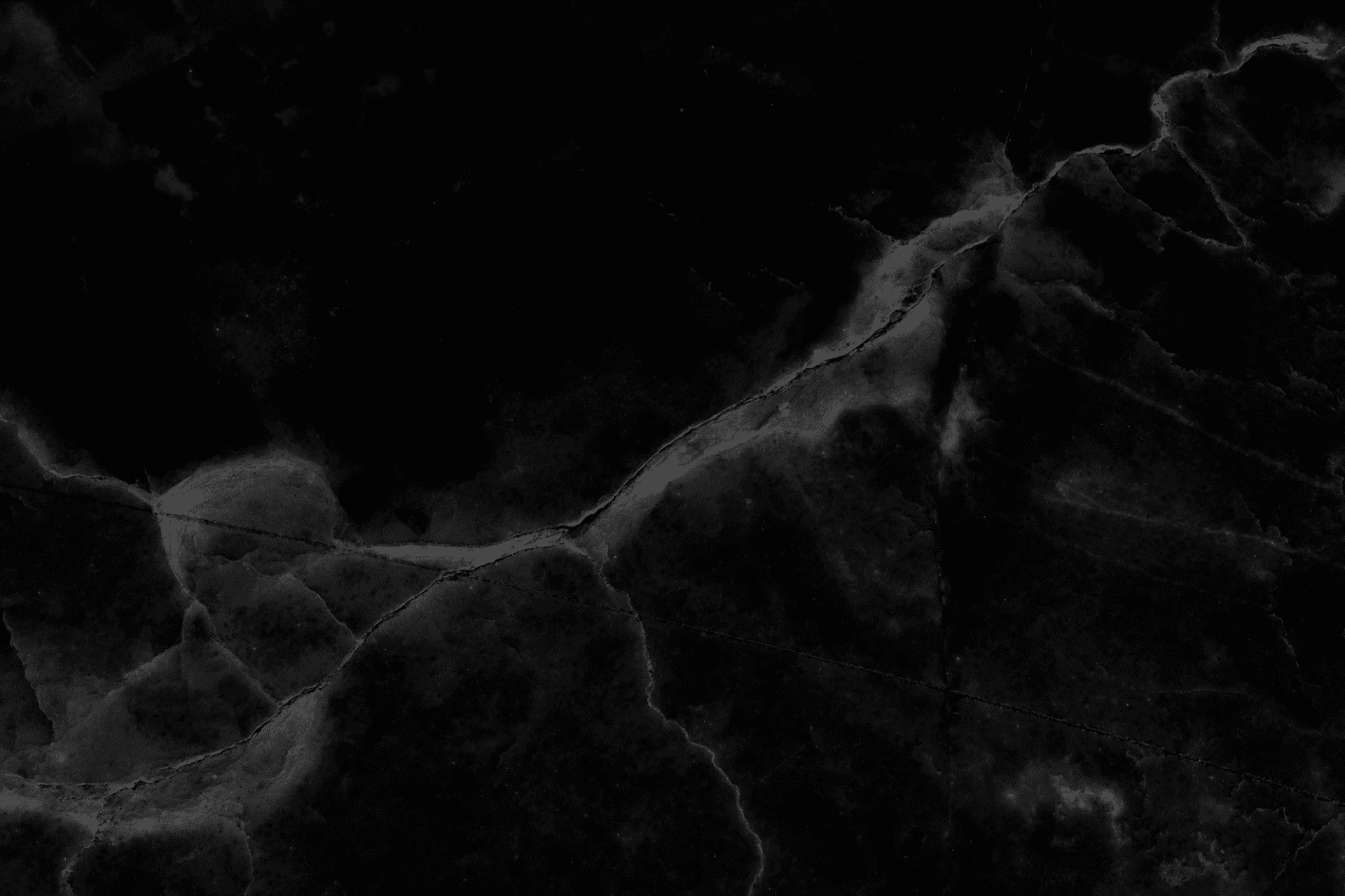 Abstract black marble texture with natural patterns.